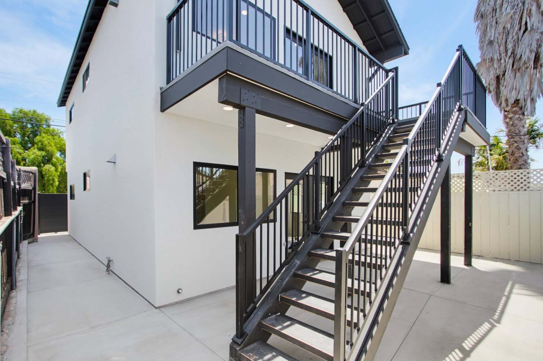 Two-story accessory dwelling unit exterior with steel stairway, San Diego